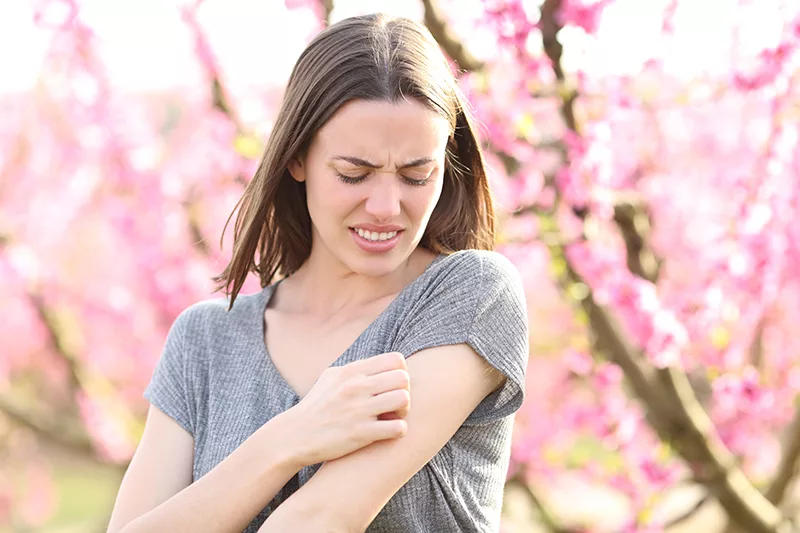 Why does spring weather cause eczema flare ups?